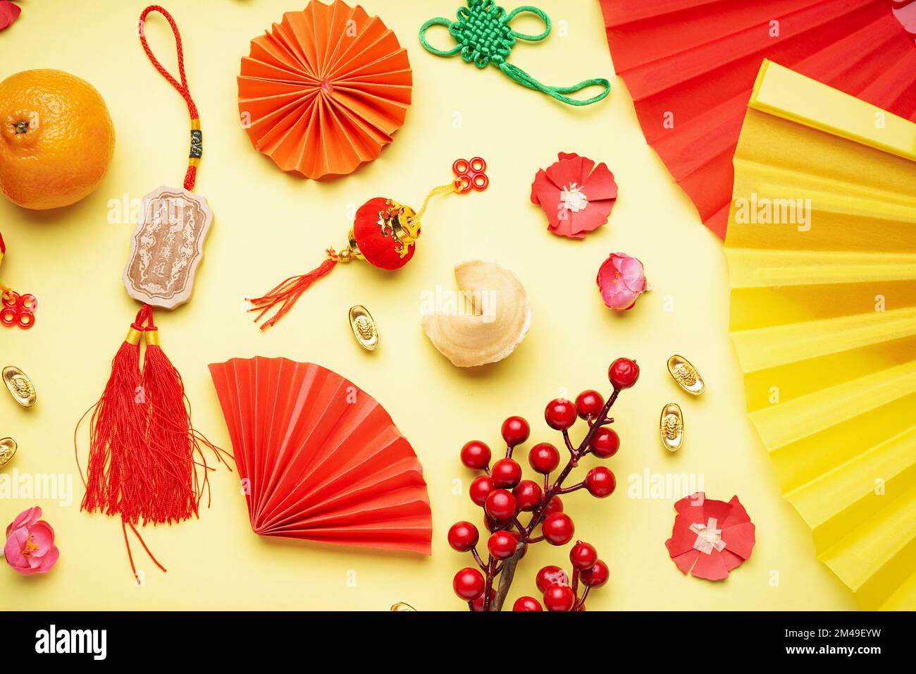 Fortune cookie, mandarin and Chinese symbols on yellow background. New