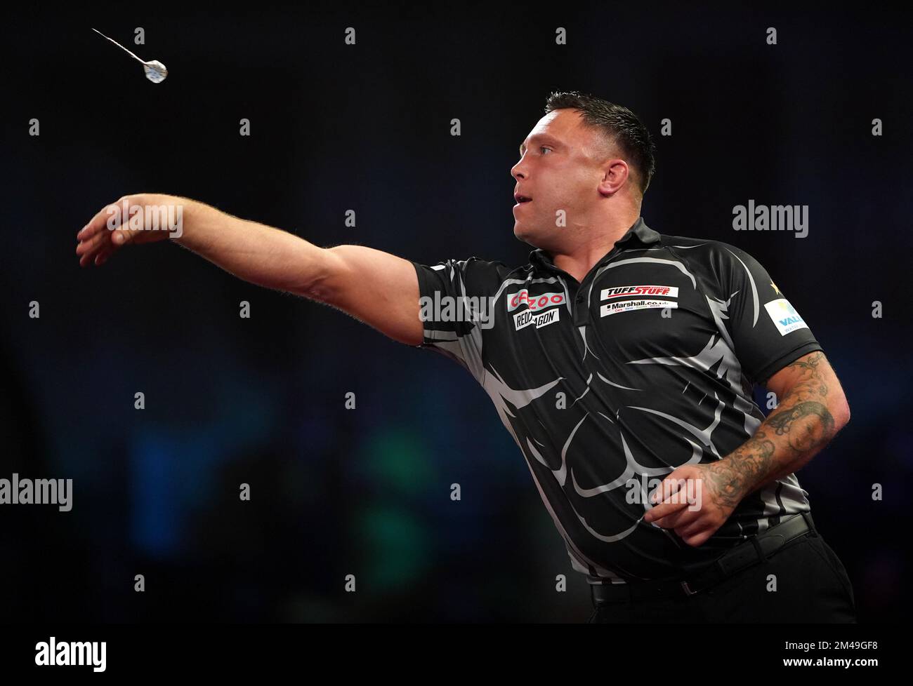 Wales' Gerwyn Price in action against England's Luke Woodhouse during day five of the Cazoo
