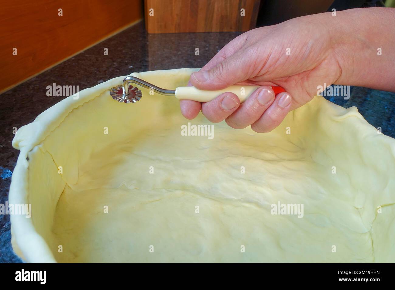 Swabian cuisine, preparing cider cake with apples, cutting the dough