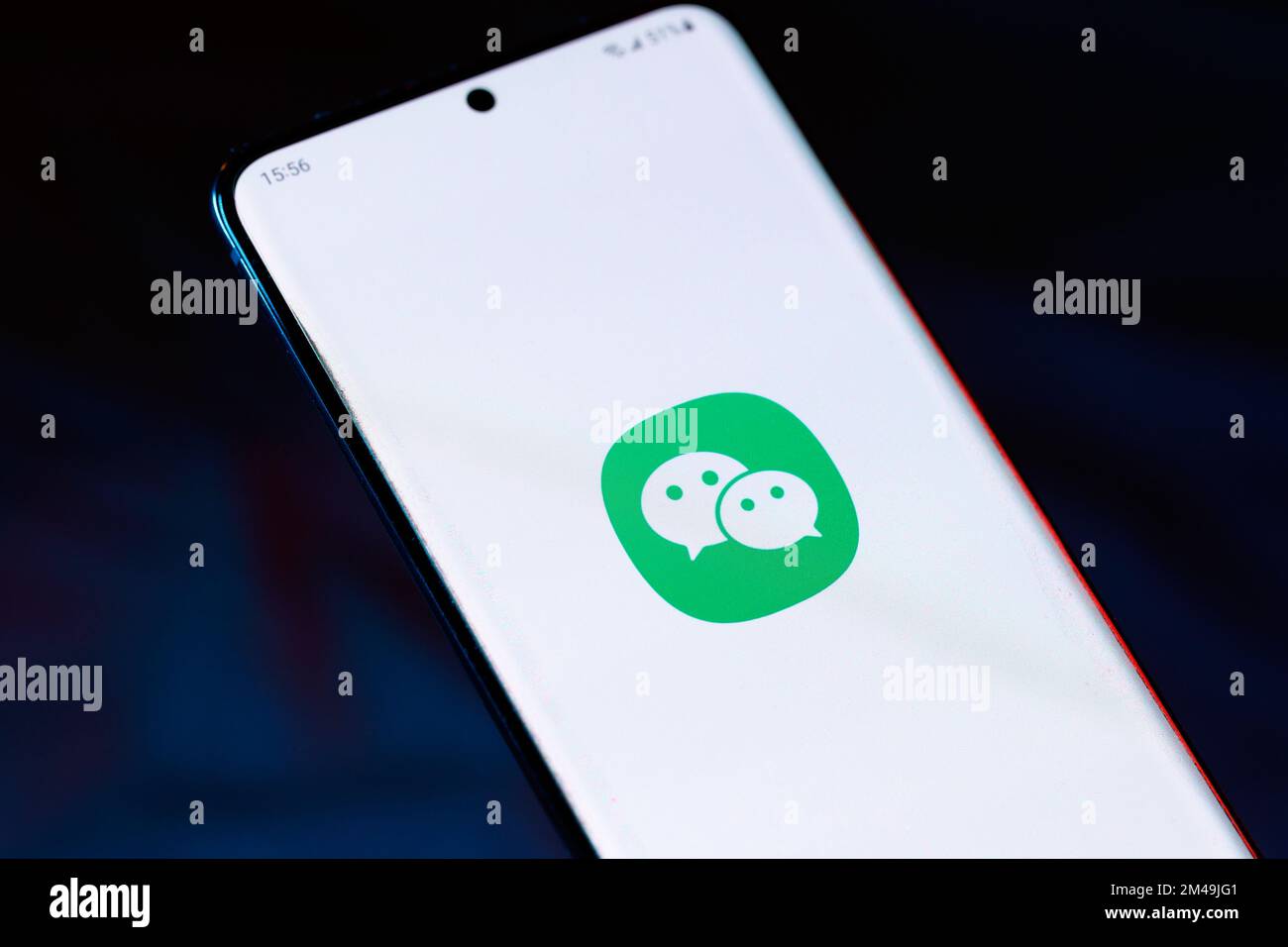 The WeChat logo on a smartphone. WeChat is a Tencent owned instant messaging app many overseas communities use to communicate with friends and family Stock Photo