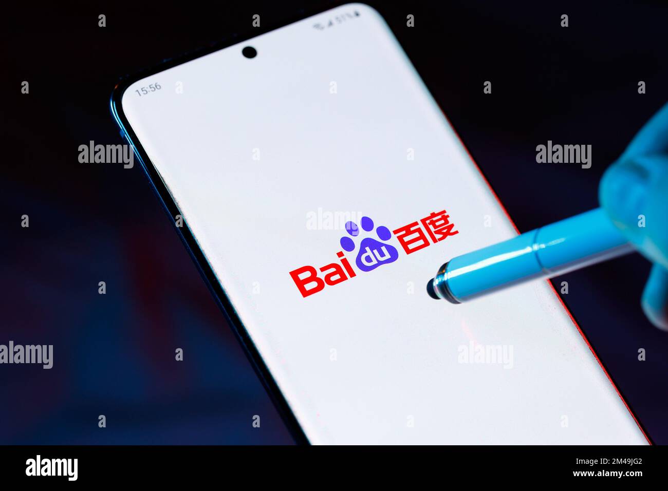 Logo of Baidu 百度 on a smartphone with a stylus pointing at the screen. Baidu is a Chinese Internet and AI tech company. Stock Photo