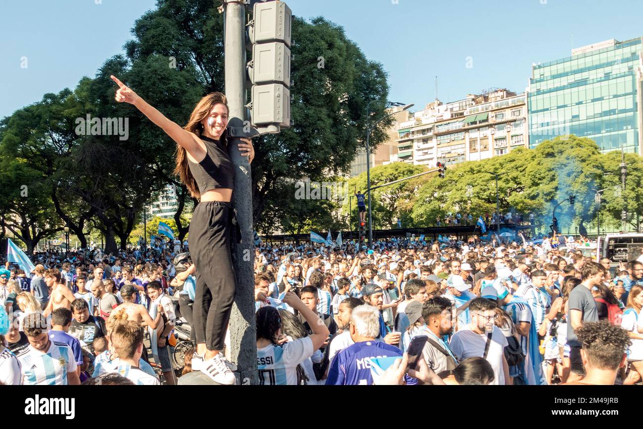 Argentine fans on Avenida 9 de Julio (9th July Avenue) in Buenos Aires, Argentina celebrate their national team winning the 2022 FIFA World Cup Stock Photo
