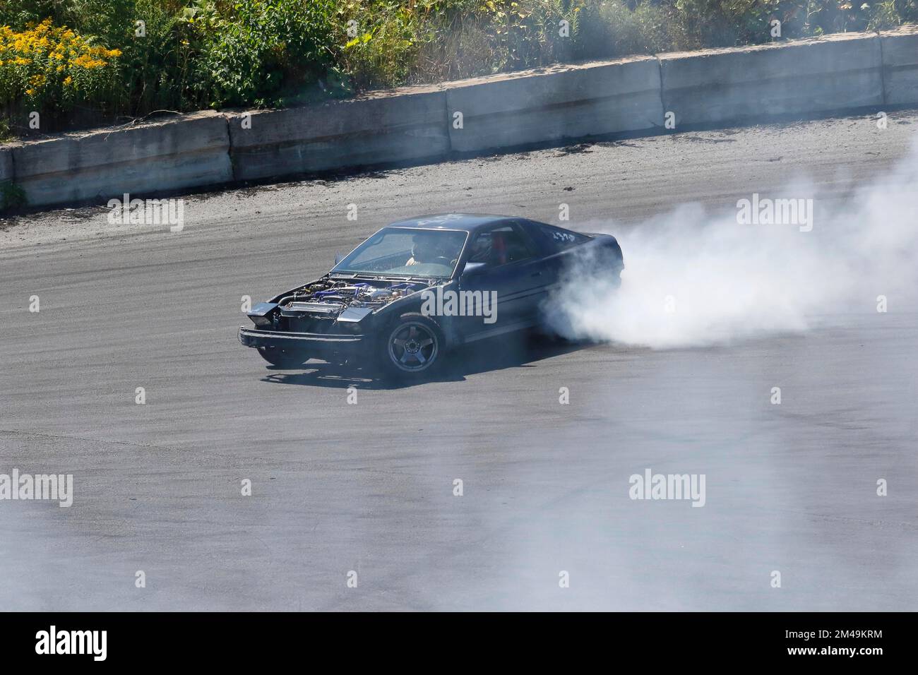 Car performing a skid test, Napierville, Province of Quebec, Canada Stock Photo