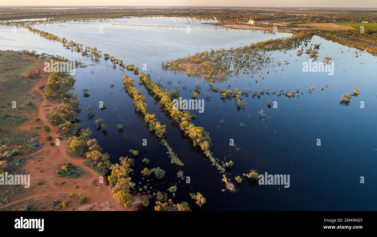 Low altitude aerial picture of riverine flooding at the edge of Wargan reserve, looking towards silos and settlement of Yelta, northwestern Victoria, Stock Photo