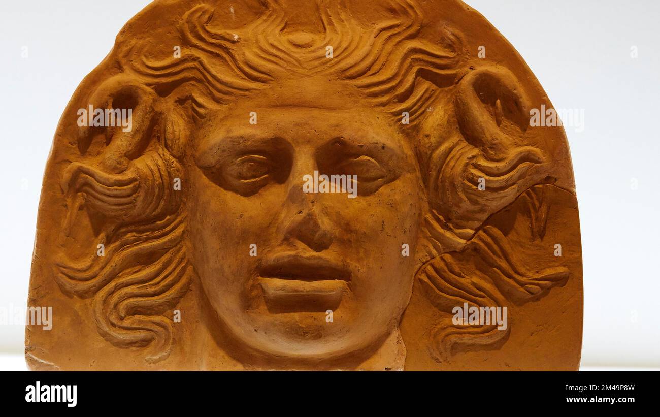 Antefix, cut, frontal tile of a building, head of Medusa, 4th c. BC, Archaeological Museum, Corfu Town, Corfu Island, Ionian Islands, Greece Stock Photo