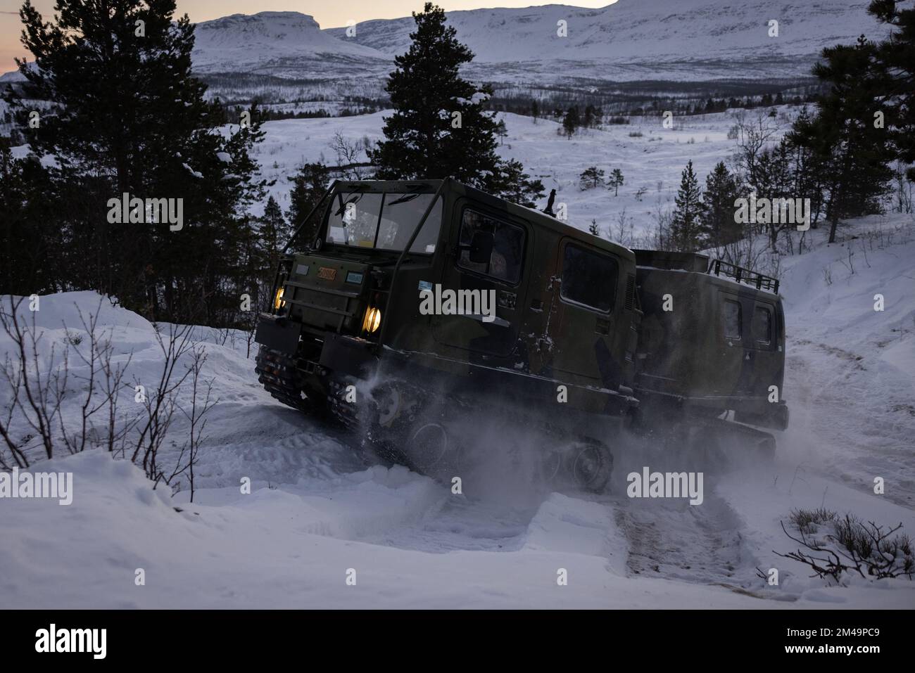 A U.S. Marine with 2d Combat Engineer Battalion, 2d Marine Division, operates a Bandvagn 206 during the Belted Vehicle Course in Forset, Norway, Dec. 10, 2022. The Belted Vehicle Course teaches Marines technical knowledge and proficiency in operating the Bandvagn 206 in the arctic environment. (U.S. Marine Corps photo by Lance Cpl. Averi Rowton) Stock Photo