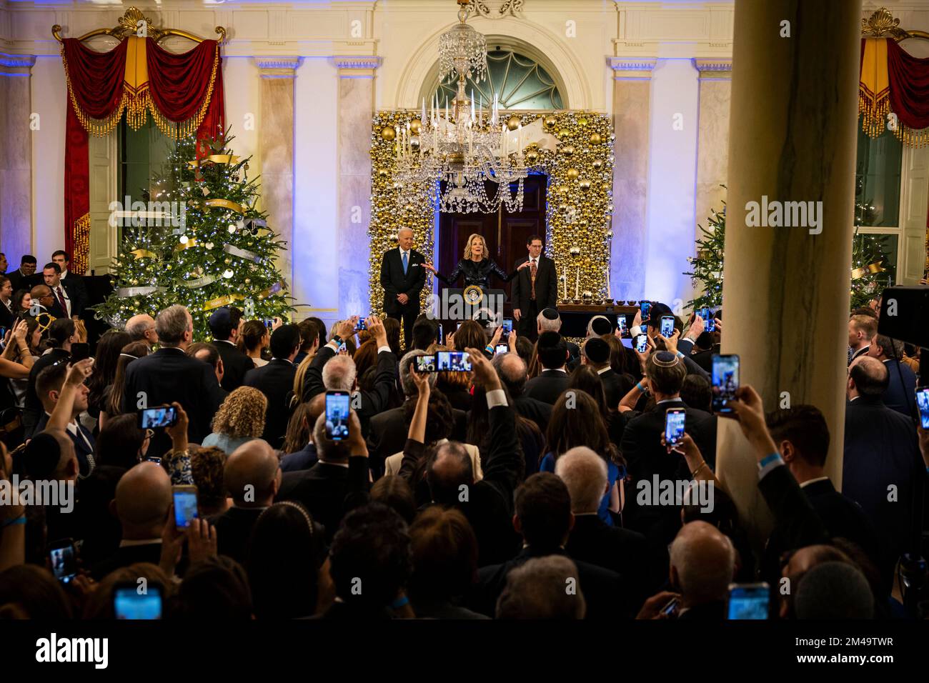 Washington, United States. 19th Dec, 2022. First Lady Jill Biden speaks alongside US President Joe Biden and Rabbi Charlie Cytron-Walker during a Hanukkah Holiday Reception in the Grand Foyer of the White House in Washington, DC, on December 19, 2022. Credit: Sipa USA/Alamy Live News Stock Photo