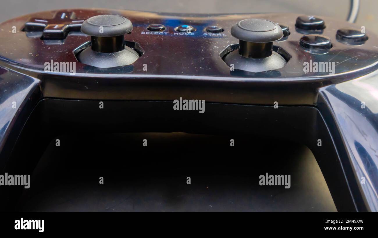 black joystick isolated on black background Stock Photo - Alamy