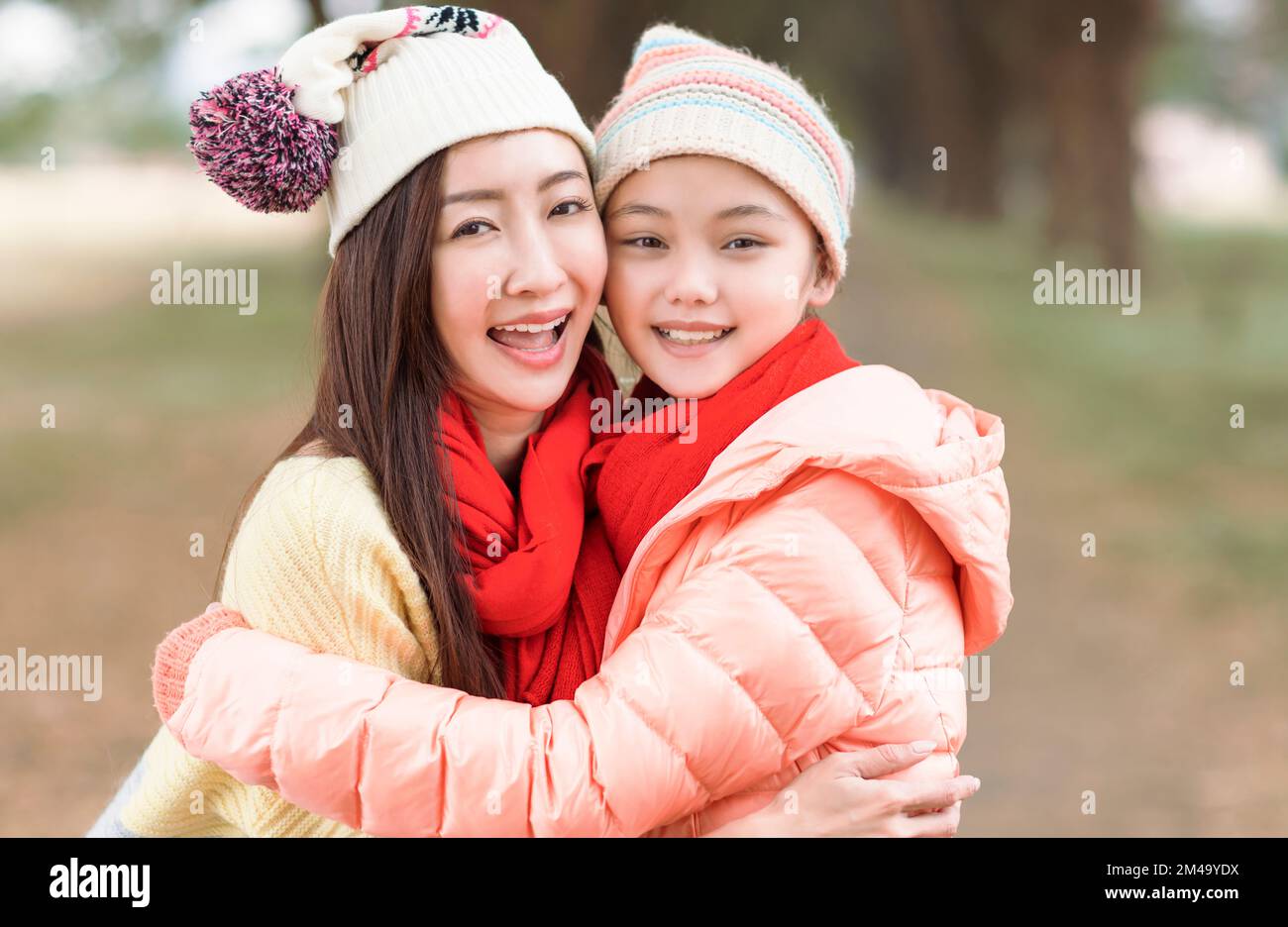 Happy Family Mother And  Daughter Playing And Laughing In the  park Stock Photo