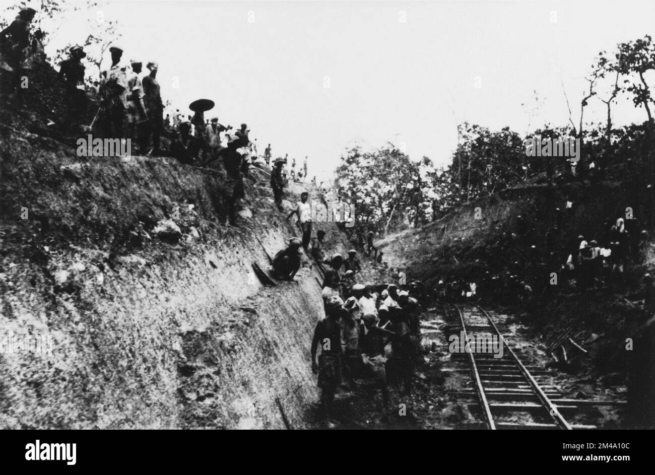 Burma / Myanmar: Tamils at work on the construction of the Burma Railway (Thai-Burma Railway) which ran 415 km (258 miles) between Ban Pong, Thailand and Thanbyuzayat, Burma. Photo from Leiden University Library (CC BY 4.0 License). Approximately 180,000 Asian civilian slave labourers and 60,000 Allied POWs were held at Thanbyuzayat by the Japanese and forced to build the Burma Railway (nicknamed by inmates the 'Death Railway') between Bangkok, Thailand, and Rangoon (Yangon), Burma. Of these, around 90,000 Asian civilian laborers and 12,399 Allied POWs died as a result of starvation, exhaust Stock Photo