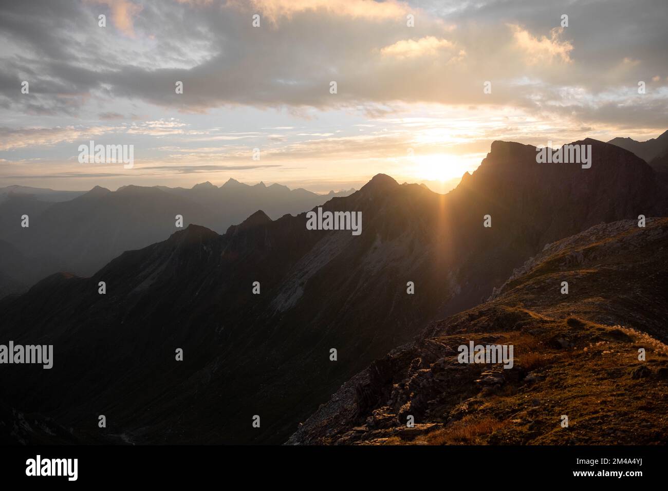 An aerial view of mountain landscape under blue sky Stock Photo - Alamy