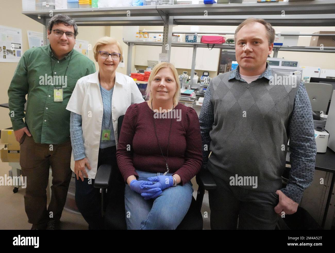 Missouri Botanical Gardens Scientists (L to R) Alexander Linan, Burgund Bassuner, Christy Edwards and Aaron Floden, shown in this Monday, December 19, 2022 photo in St. Louis, were able to match the DNA of juniper needles found on muddied boots to the DNA of individual junipers at the site where the remains of Mengqi Ji of Columbia, Missouri were found. Edwards, Linan, and Aaron Floden testified at trial. Floden assisted by comparing the plant samples found on the accused's boots with vegetation at the grave site.The accused, Joseph Elledge was found guilty of the October 2019 murder of his w Stock Photo