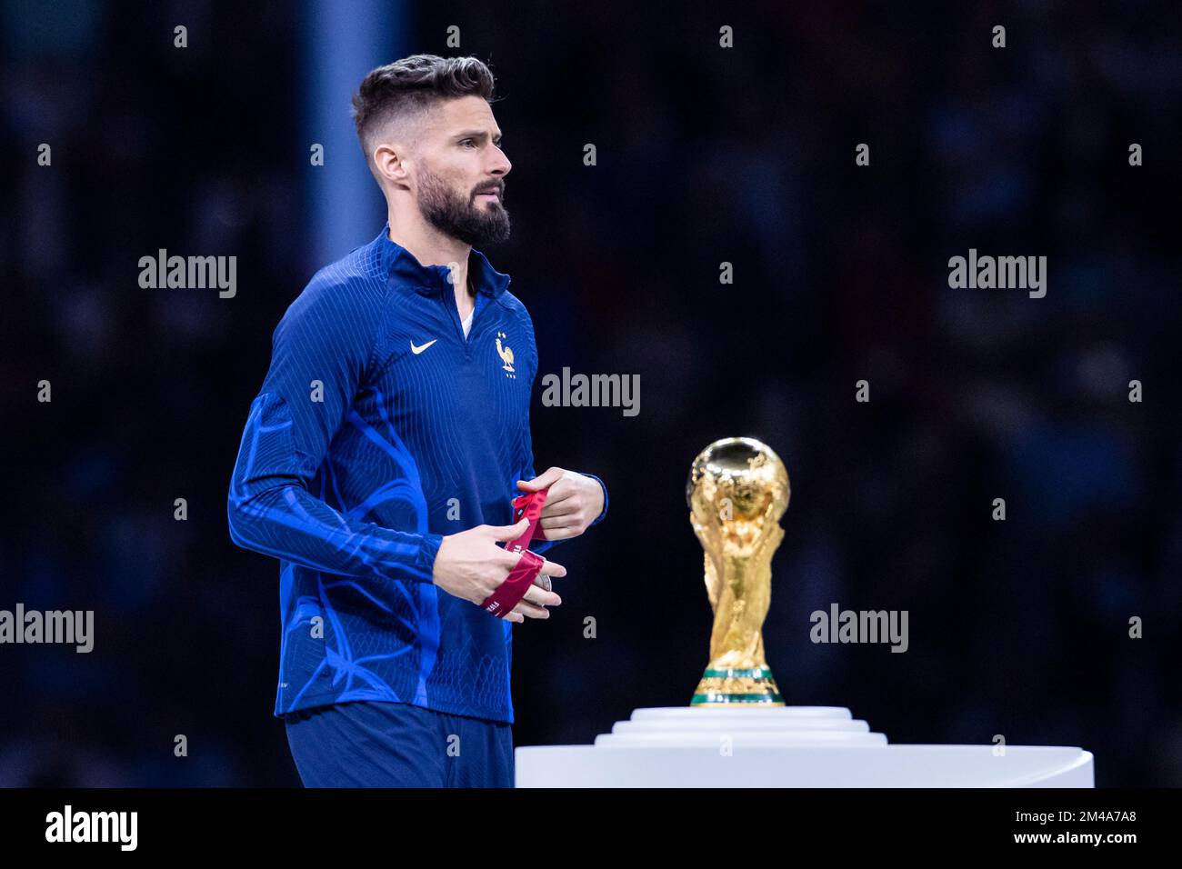 Lusail, Qatar. 18th Dec, 2022. Soccer: World Cup, Argentina - France, final round, final, Lusail Stadium, France's Olivier Giroud walks past the World Cup trophy during the award ceremony. Credit: Tom Weller/dpa/Alamy Live News Stock Photo