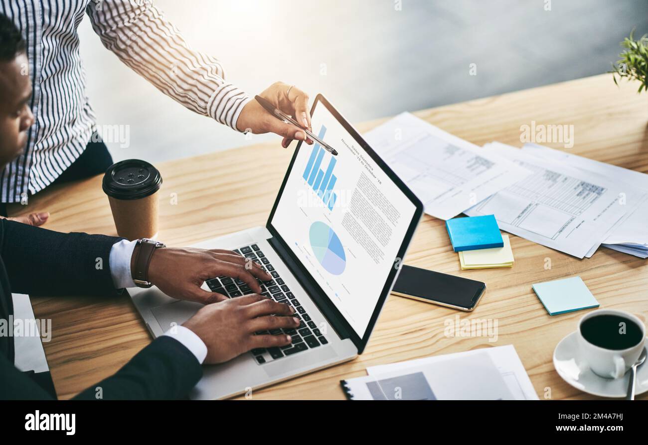 Businessperson analyzing graphs desk hi-res stock photography and ...