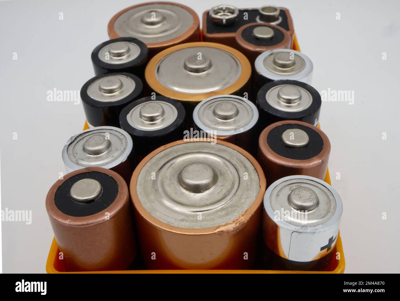 Batteries of different sizes and formats in a box, selective focus