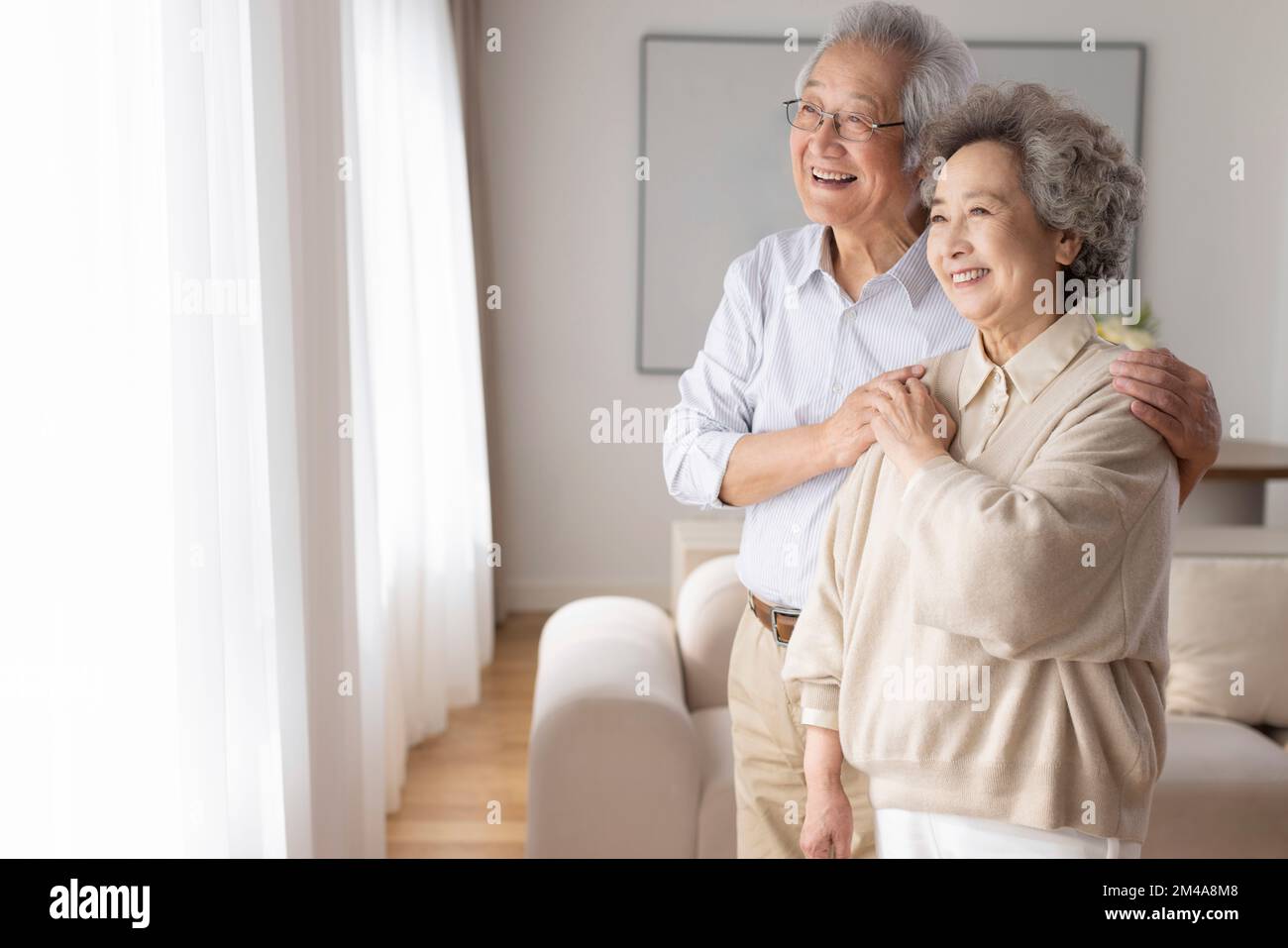 Cheerful senior Chinese couple relaxing at home Stock Photo - Alamy