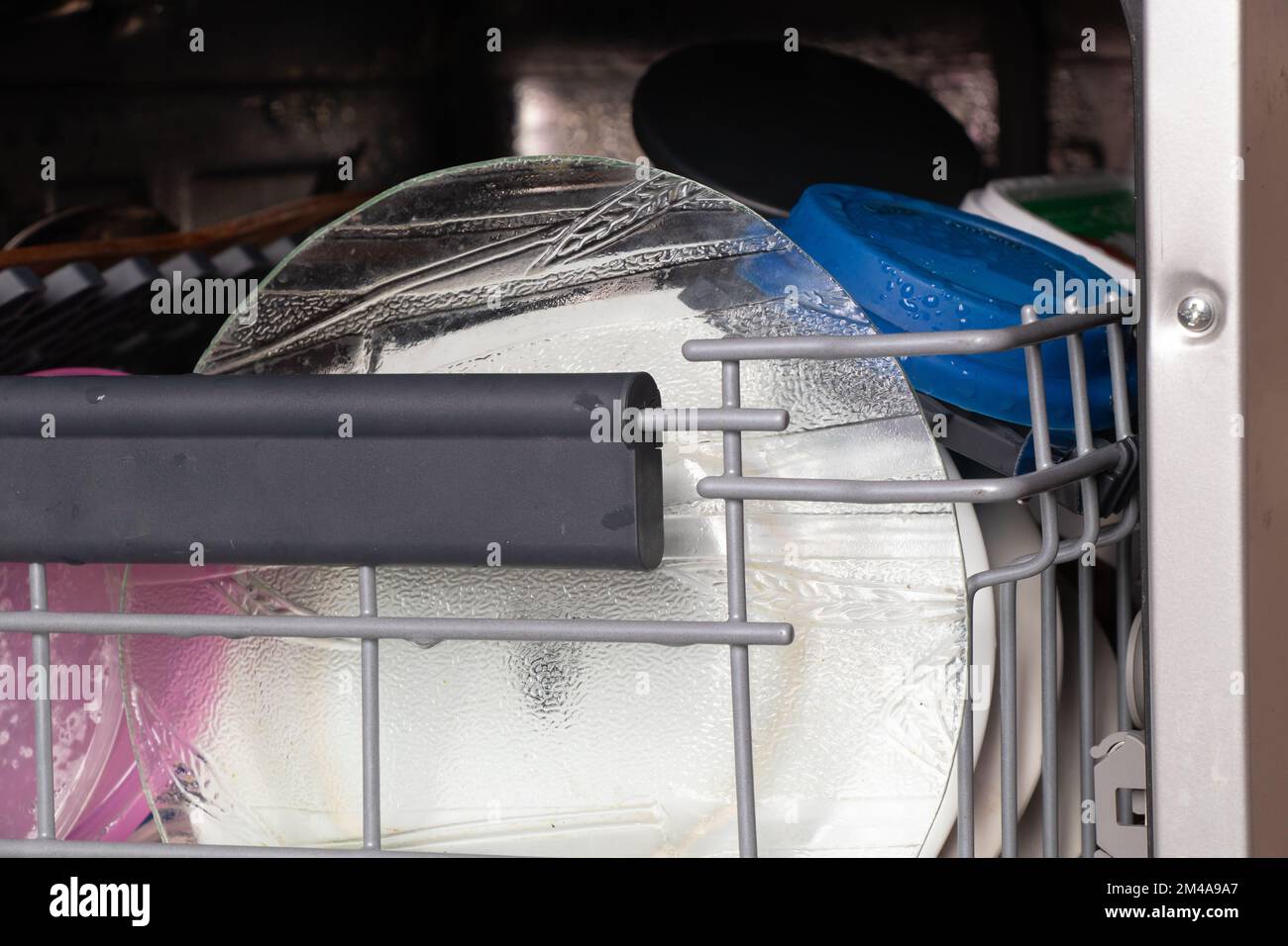 dishwasher with clean plates in the kitchen Stock Photo Alamy