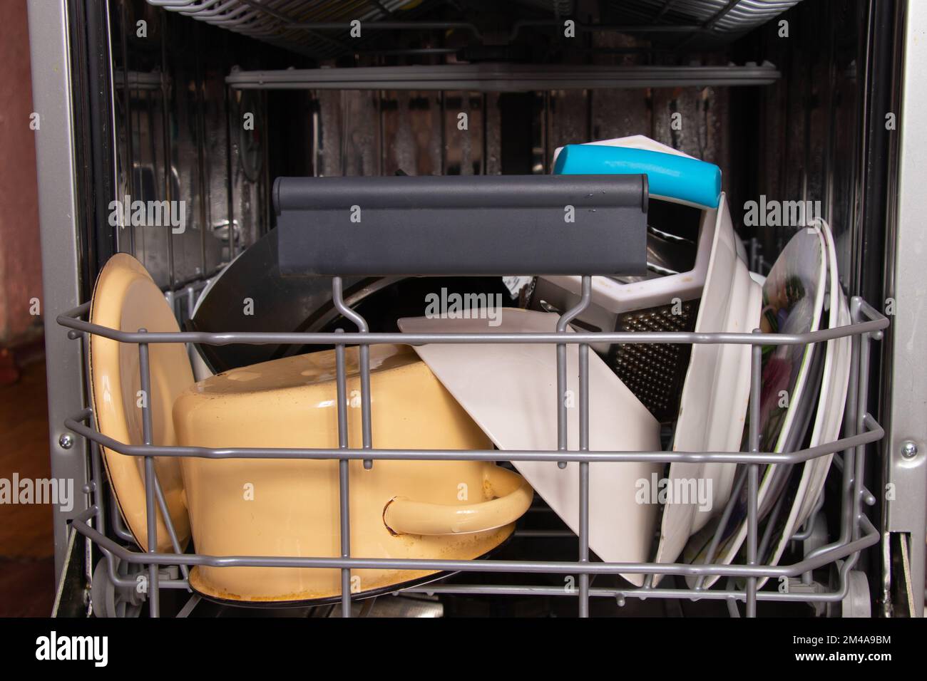 dishwasher with clean plates in the kitchen Stock Photo Alamy