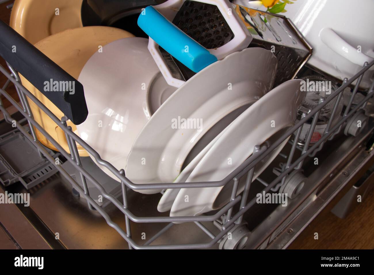 dishwasher with clean plates in the kitchen Stock Photo Alamy