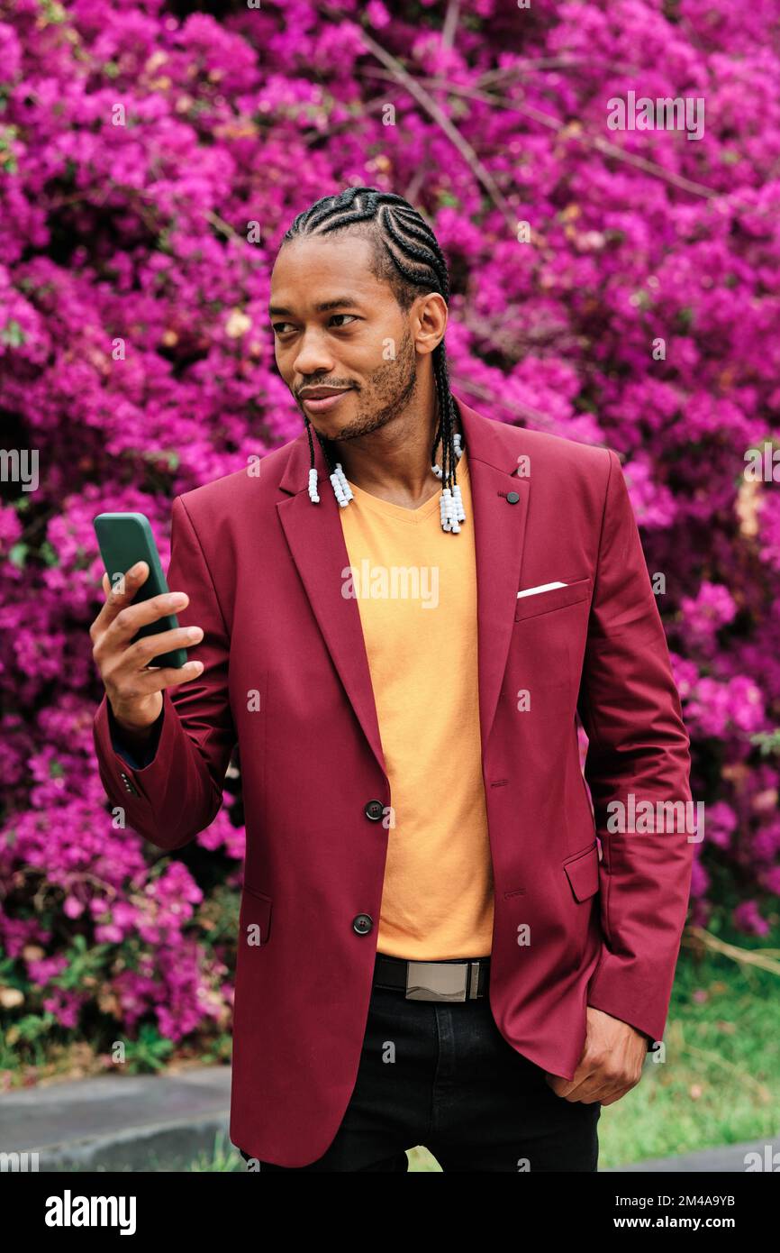 Handsome african stylish man using a mobile outdoors Stock Photo