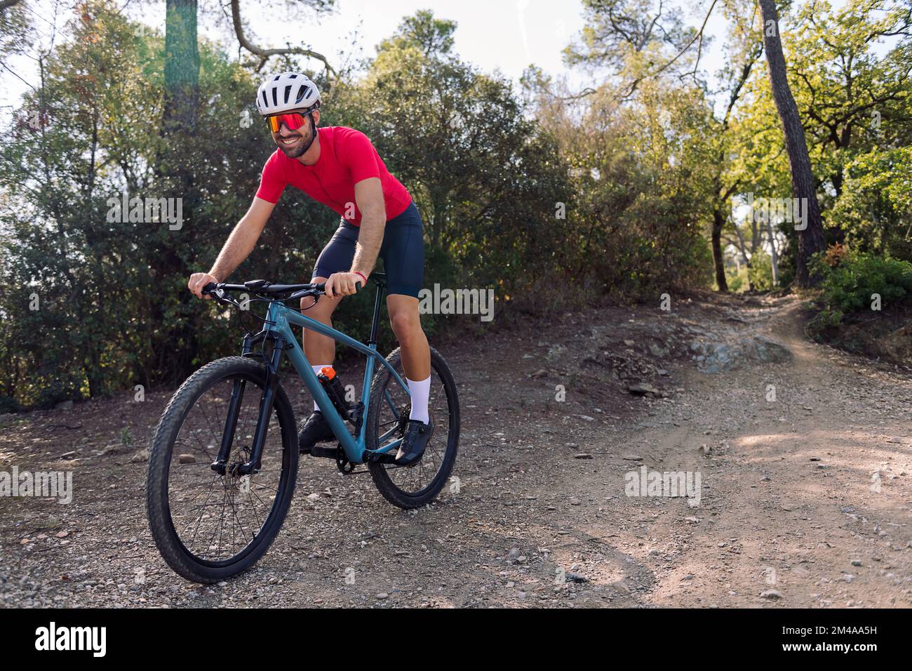 happy cyclist training with his mountain bike Stock Photo