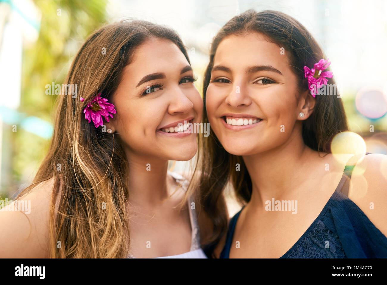 Our friendship blossoms more everyday. Portrait of two female best friends spending the day in the city. Stock Photo