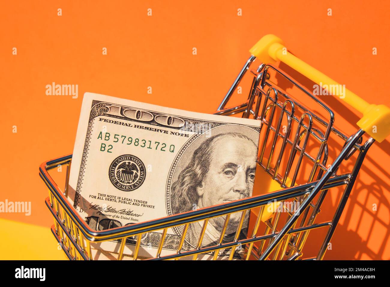 US dollar paper currency 100 banknote money Shopping trolley cart on