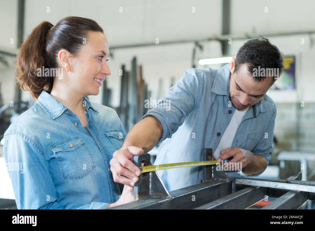 two worker on work bench in the factory Stock Photo