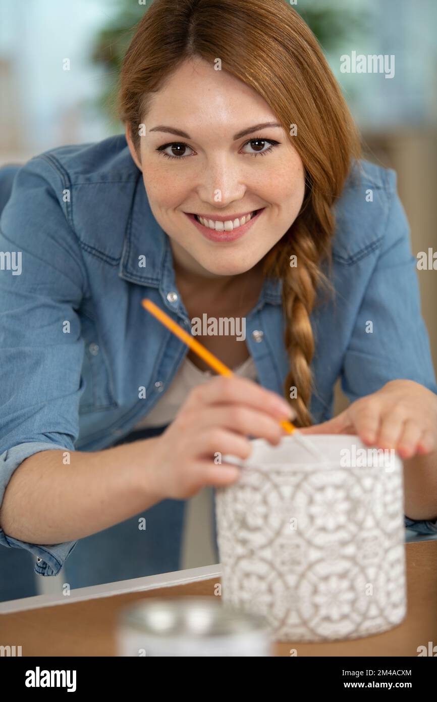 happy woman during pottery painting Stock Photo - Alamy