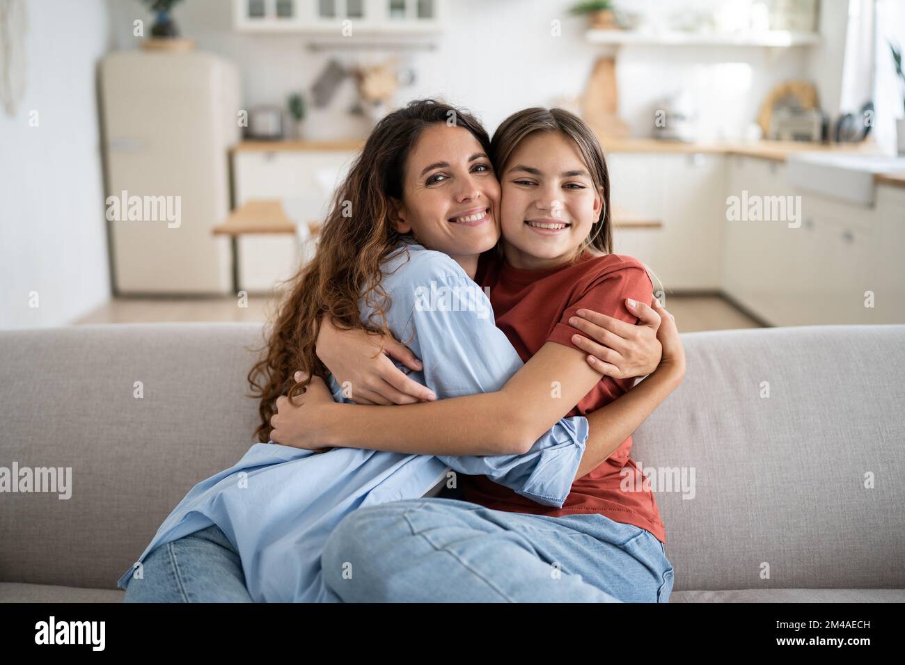 Young Woman Loving Mother Hugging Embracing Her Happy Adopted Daughter