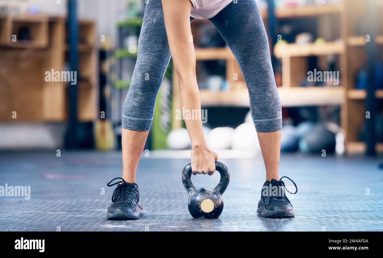 Fitness, gym and kettlebell training by woman hands weightlifting for health, wellness and power goals, Exercise, weights and hand of girl in sports Stock Photo
