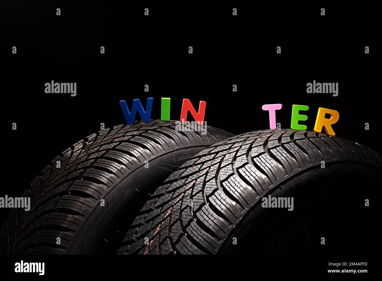 Winter Car tire for snow isolated on white background with copy space for text.  New automobile tyre. Stock Photo
