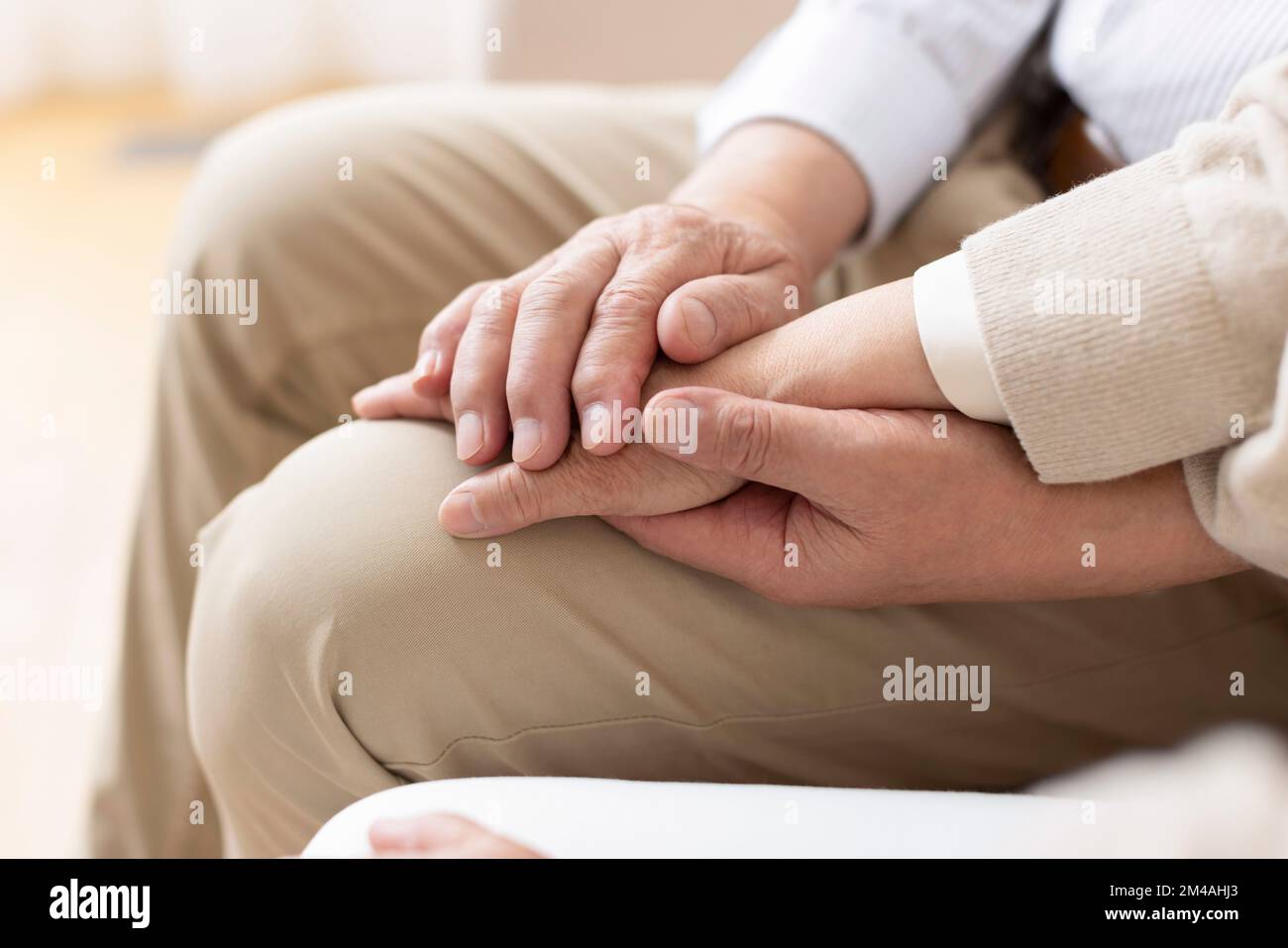 Senior Chinese couple holding hands Stock Photo