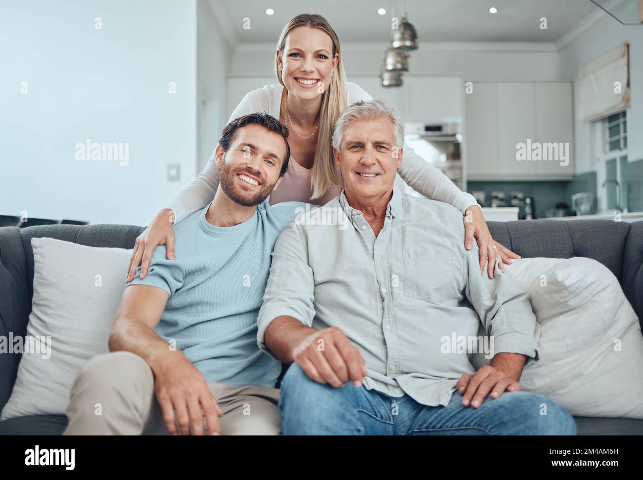 Family, portrait and relax on sofa in living room, smiling and bonding. Love, care and happy man, woman and grandfather sitting on couch having fun Stock Photo