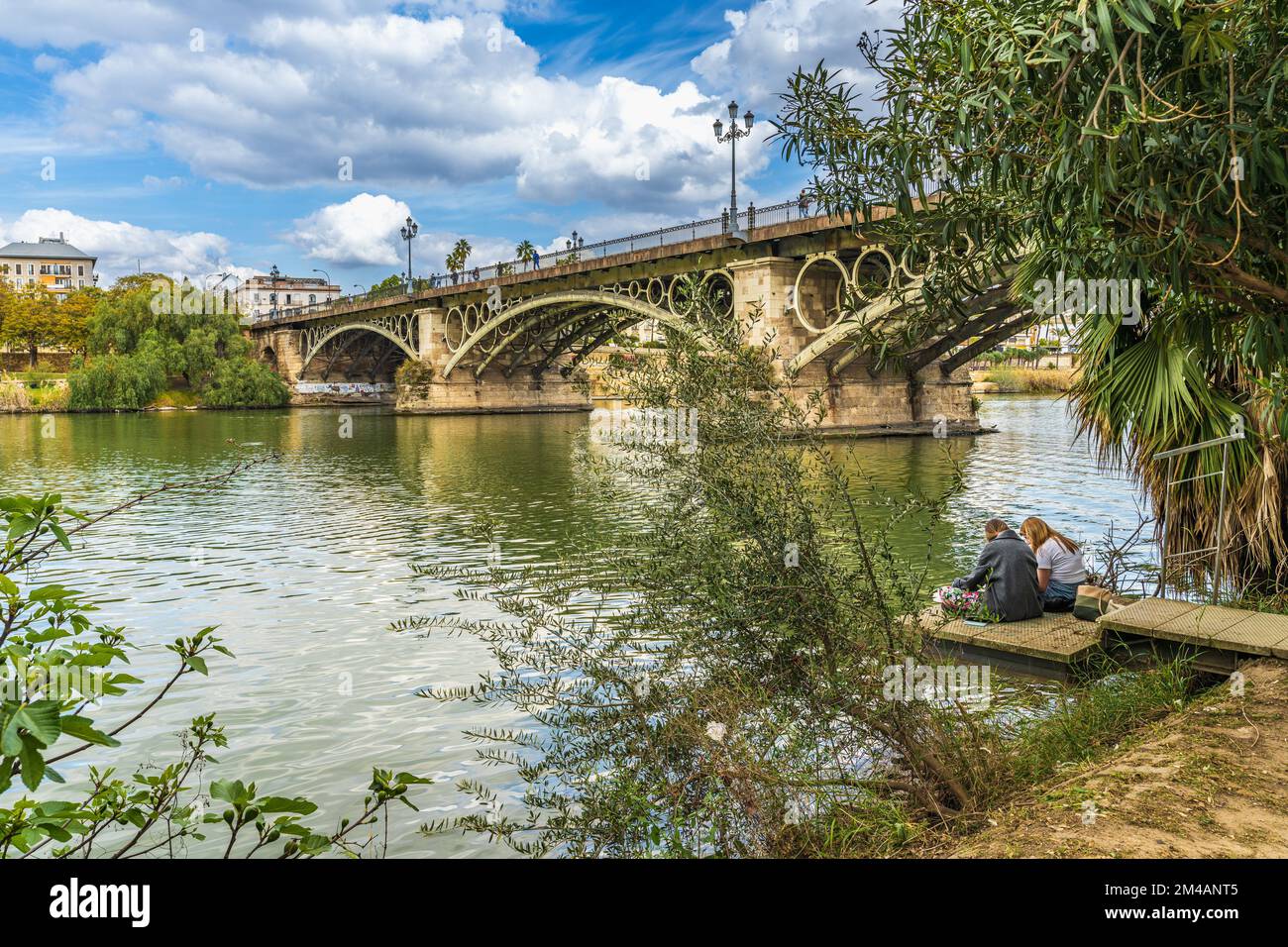 Seville, Spain, March 10, 2022. Guadalquivir river and Triana neighborhood in the city of Seville Stock Photo