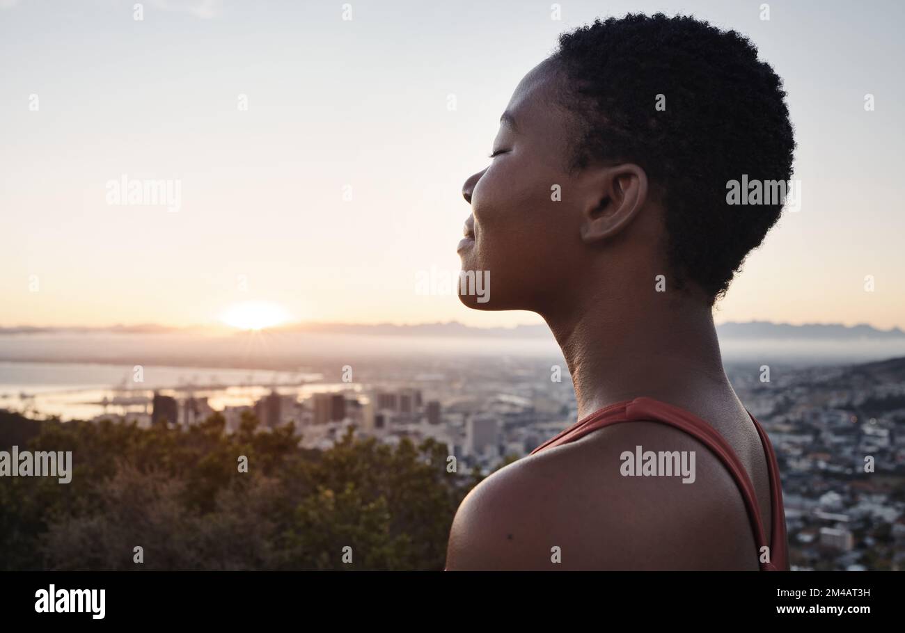 Fitness, breathing or zen black woman in meditation in nature thinking of wellness goals, vision or target. Healthy, spiritual or peaceful happy Stock Photo