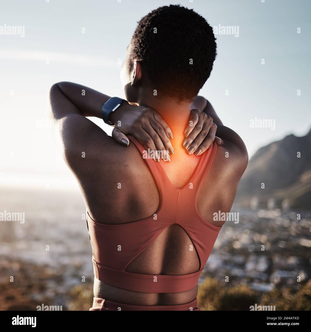 Back pain, fitness and black woman in nature experience running training accident in mountains. Woman athlete back on a run feeling pain from exercise Stock Photo