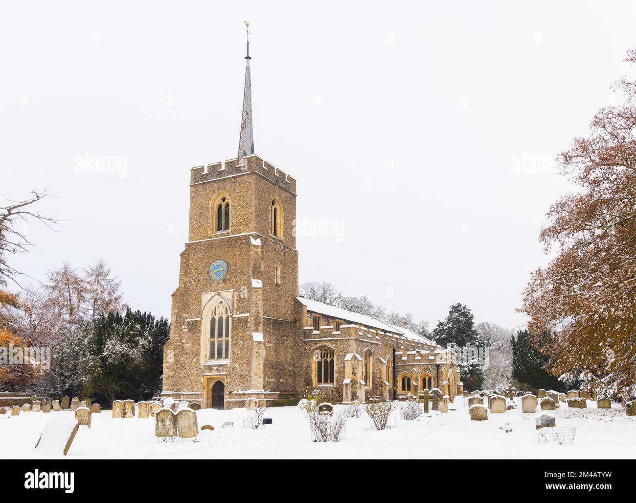 Traditional English village church covered in Snow. St Andrews Church, Much Hadham, Hertfordshire. UK Stock Photo