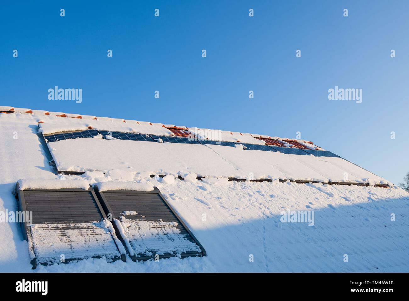 Melting snow from solar panels on roof Stock Photo Alamy