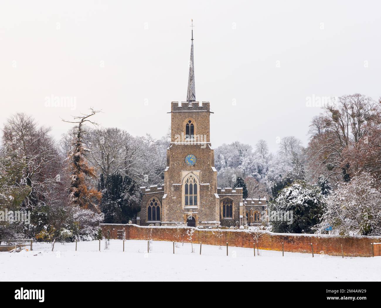 Traditional English village church covered in Snow. St Andrews Church, Much Hadham, Hertfordshire. UK Stock Photo