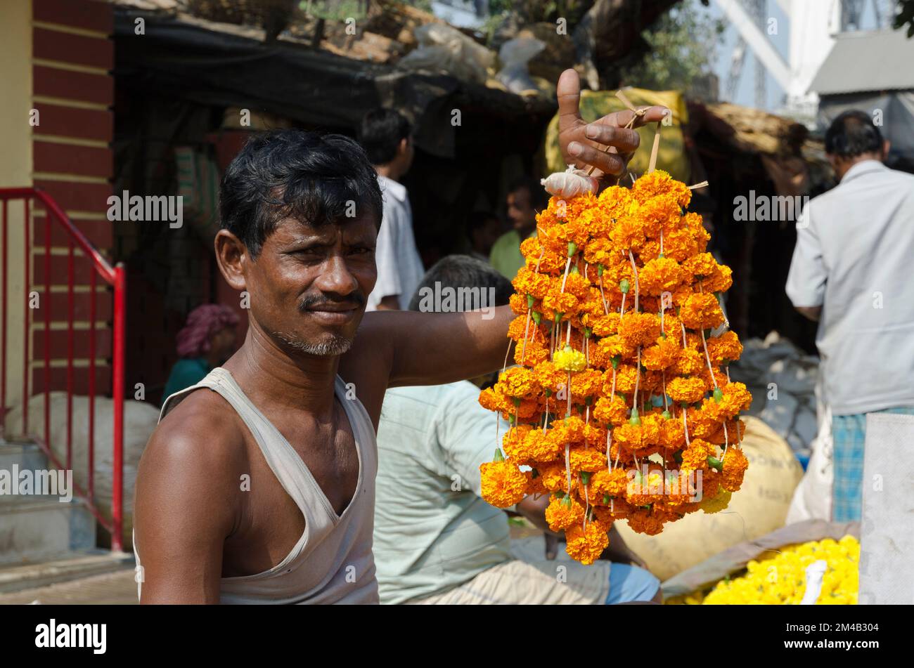 Vendor at the flowermarket of Kolkata.The 125-year Kolkata Flower Market is eastern India’s largest flower market with hundreds of stalls and people s Stock Photo