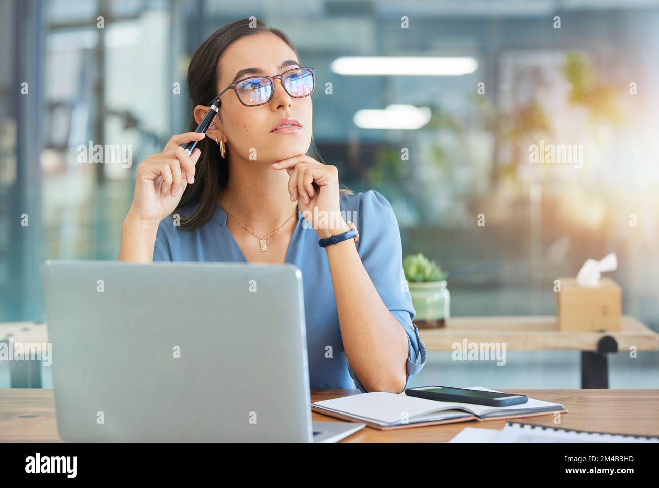 Business woman, thinking and office with laptop, concentration and sales growth. Ceo, female entrepreneur and administrator with idea for advertising Stock Photo