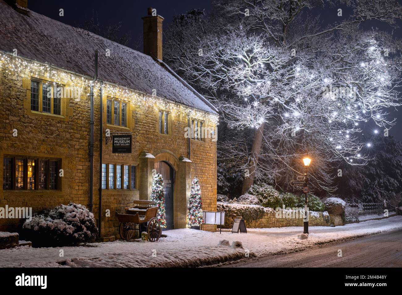 Broadway museum and Christmas tree light decorations at night in the