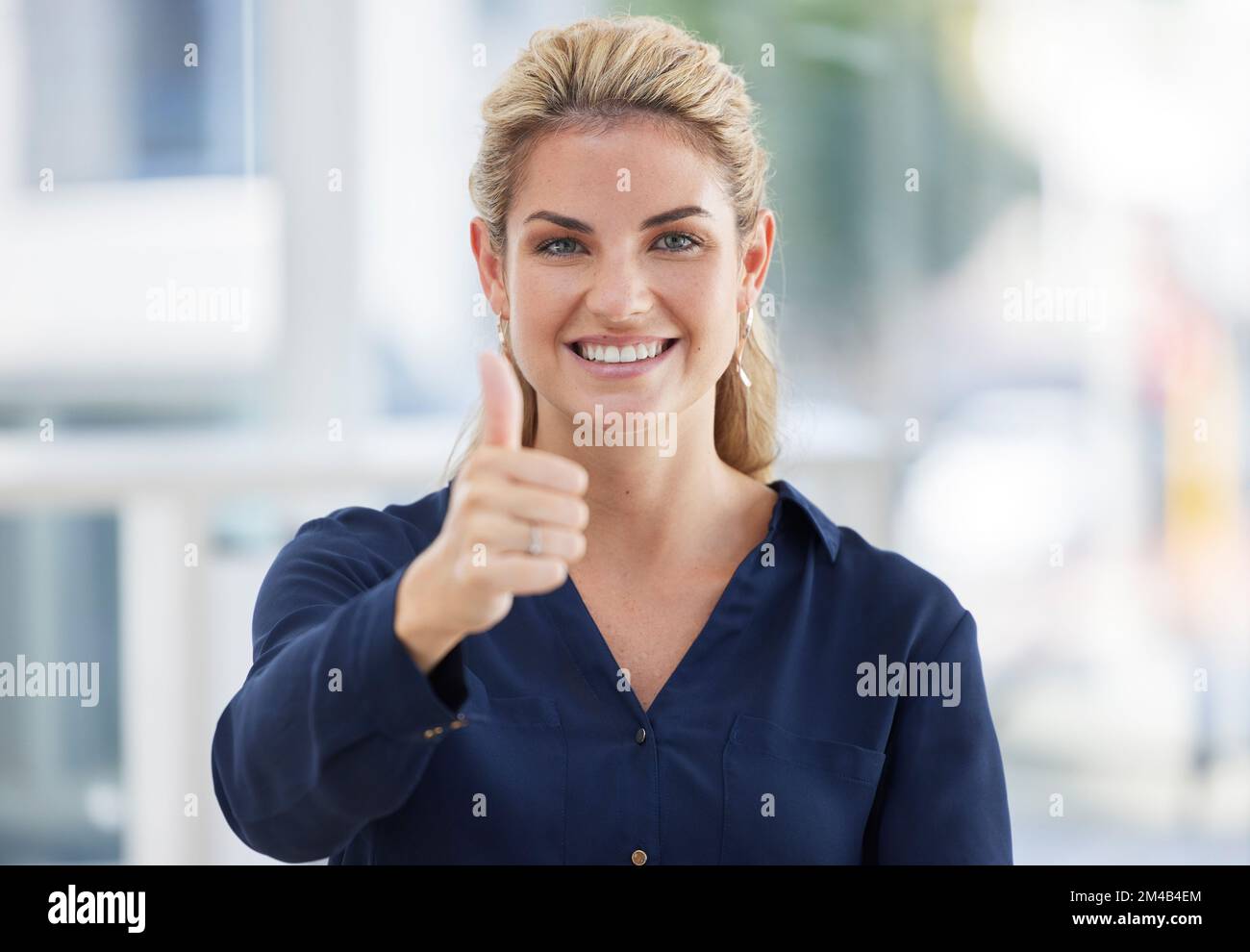 Thumbs up, woman face portrait and smile in office for business success, corporate achievement and entrepreneur motivation. Leadership confidence, ceo Stock Photo