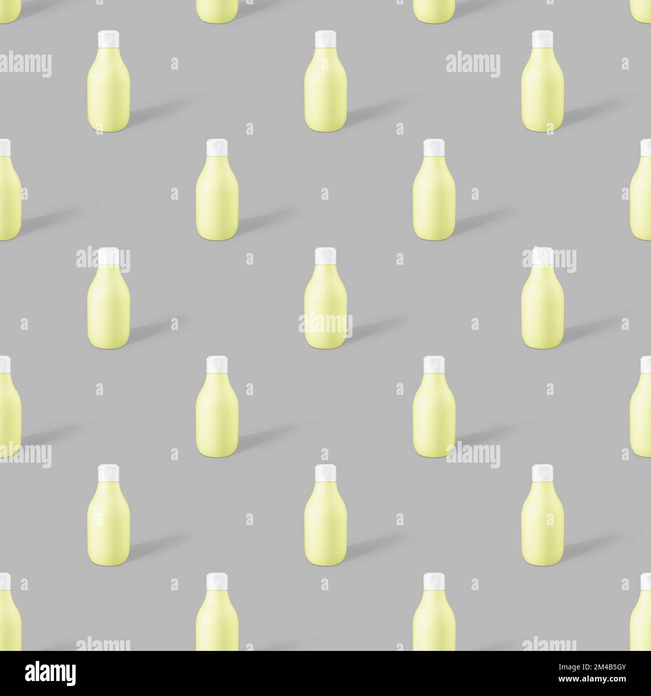 seamless pattern of yellow biodegradable plastic cosmetic bottle mockup on a trendy gray background. Concept photo Stock Photo