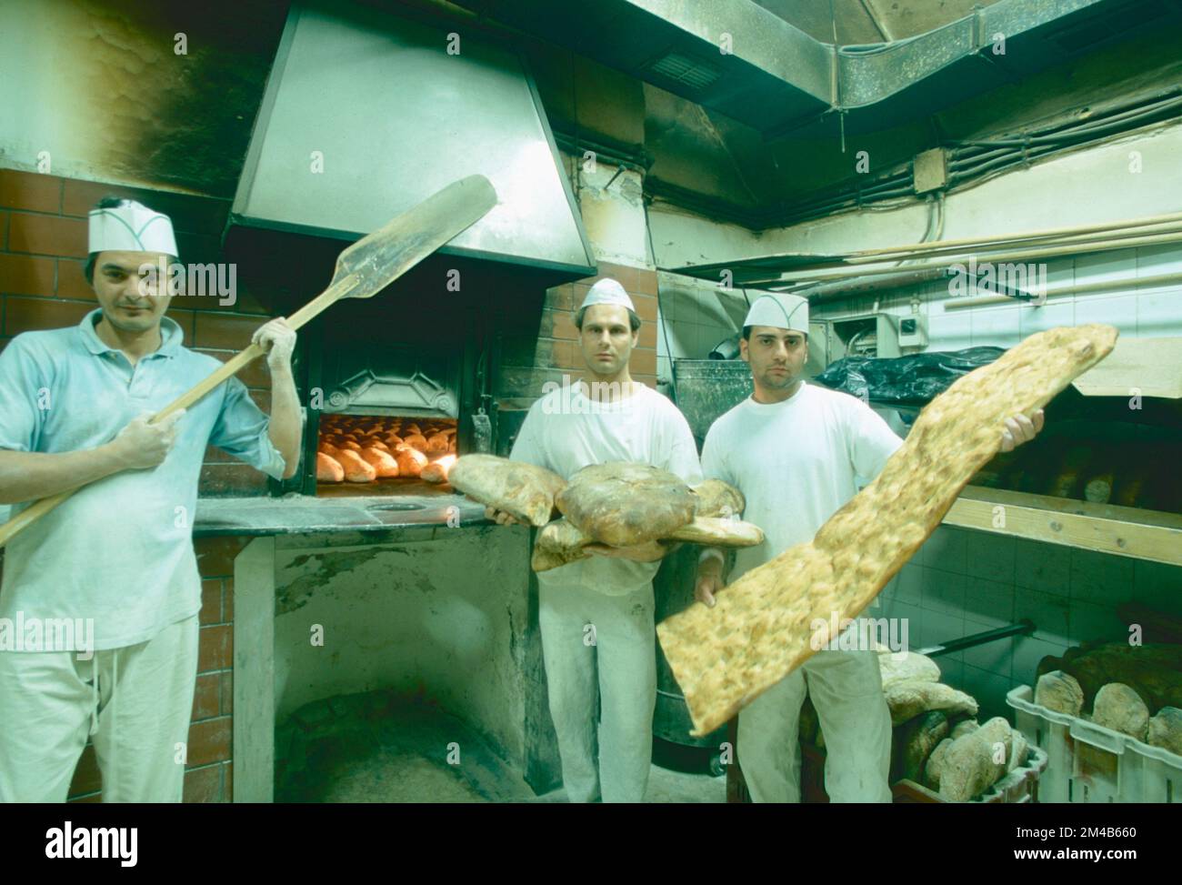 Italian bakers making bread and pizza bianca, Rome, Italy 1994 Stock Photo