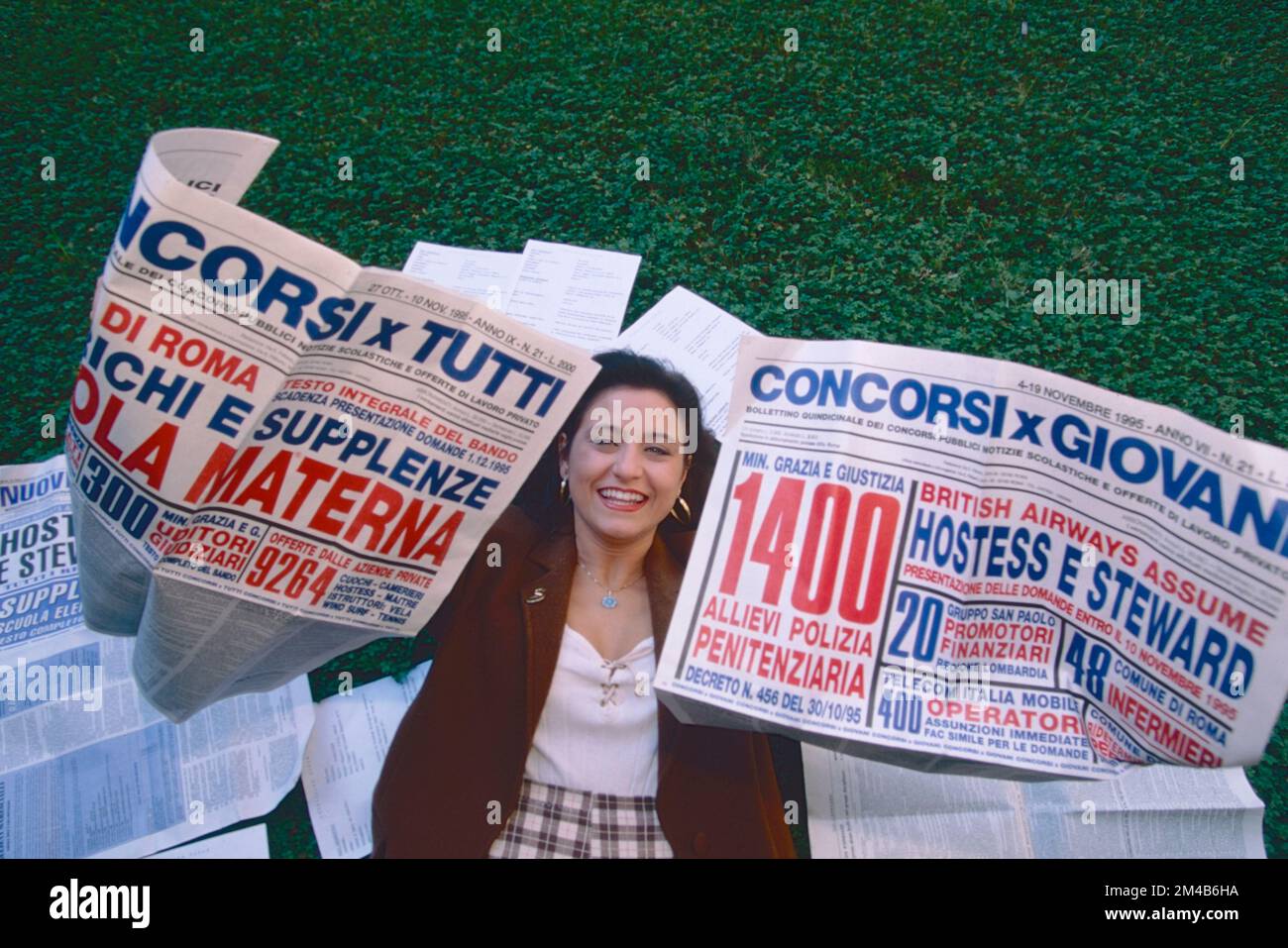 girl-with-public-competition-newspapers-rome-italy-1990s-stock-photo