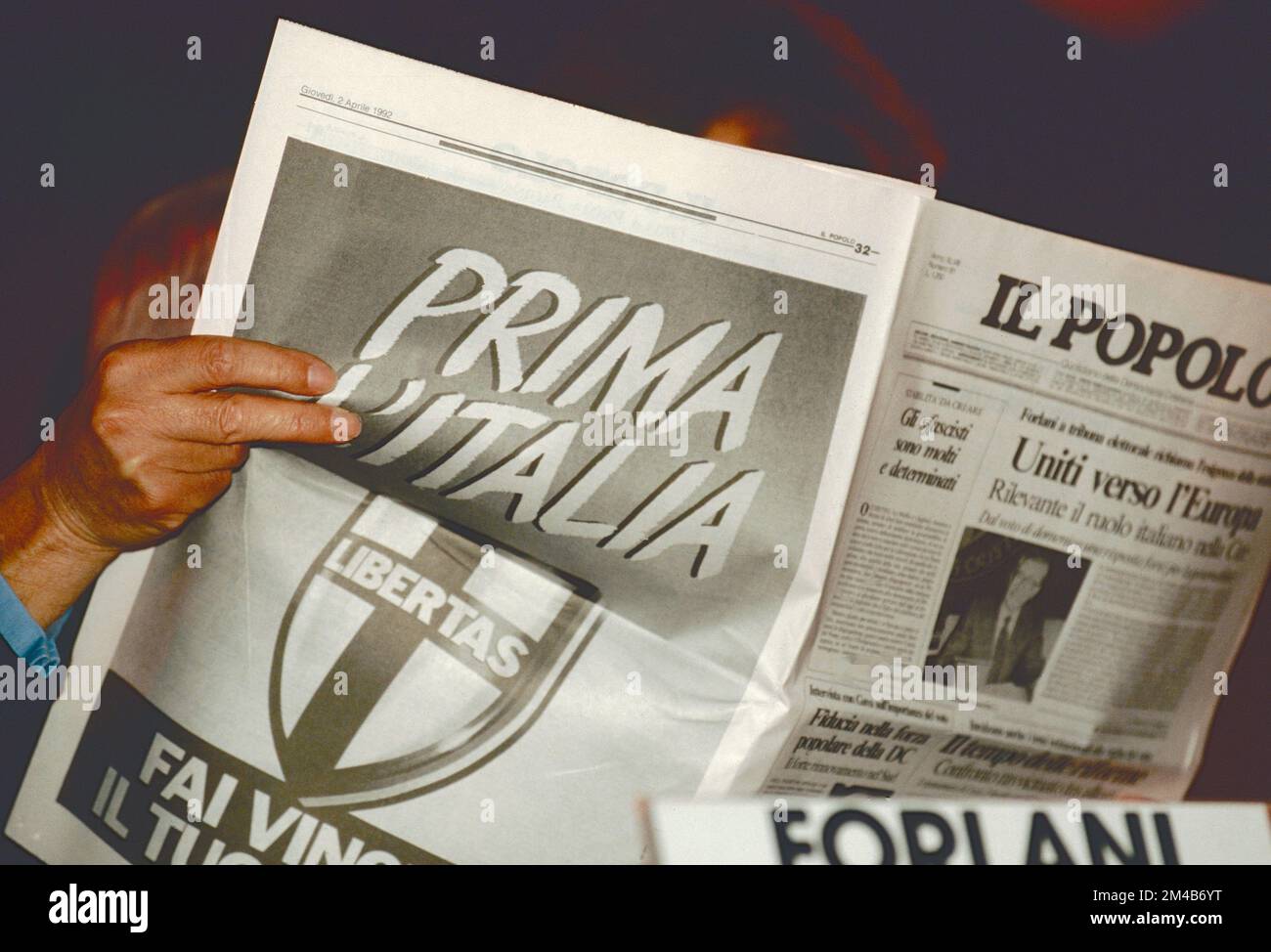 Reading Il Popolo newspaper at the feast of the Christian Democrats party, Rome, Italy 1992 Stock Photo