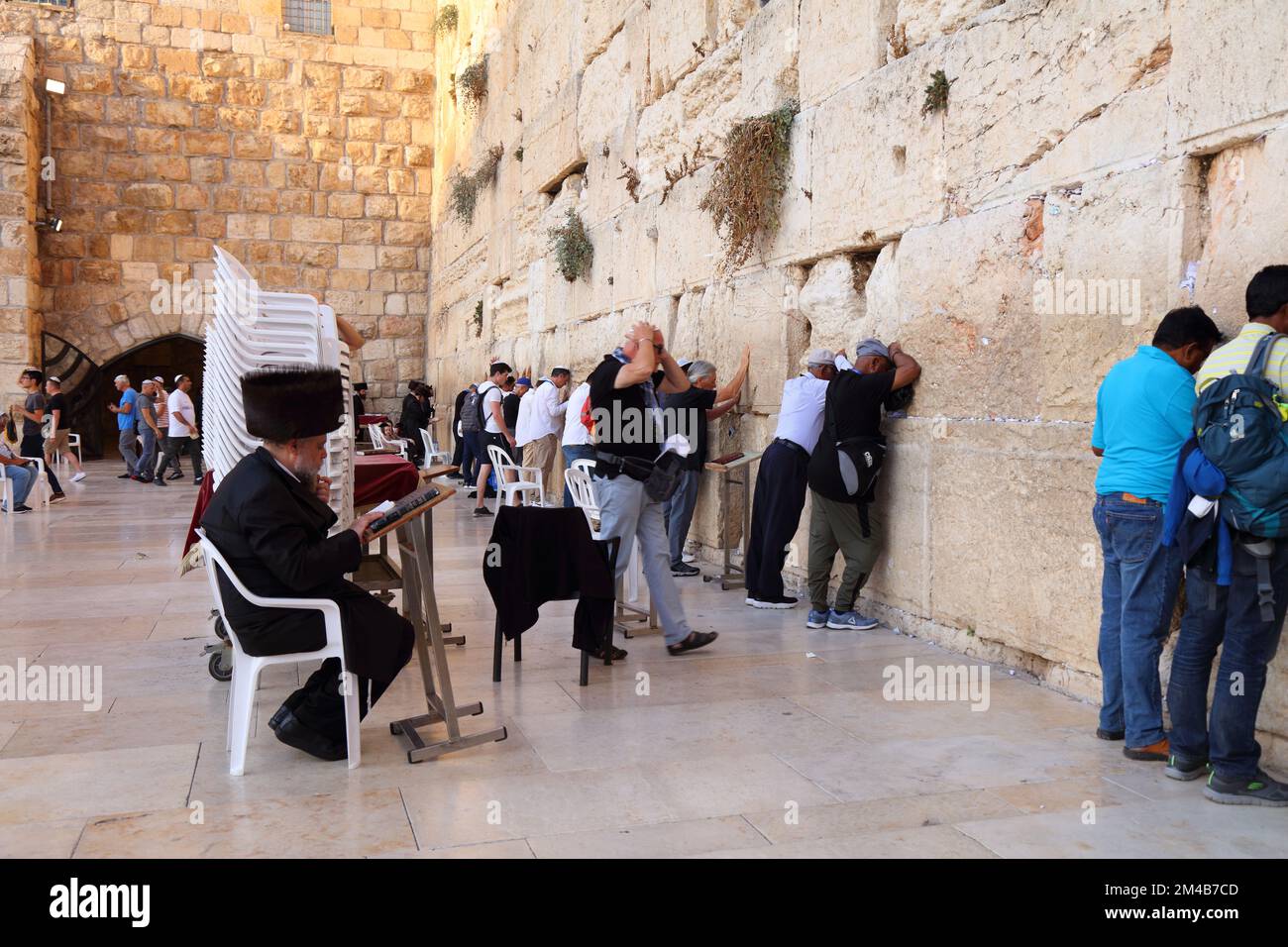 JERUSALEM, ISRAEL - OCTOBER 28, 2022: People visit the Western Wall (or Wailing Wall) in Jerusalem Old City. It is part of Jerusalem's UNESCO World He Stock Photo