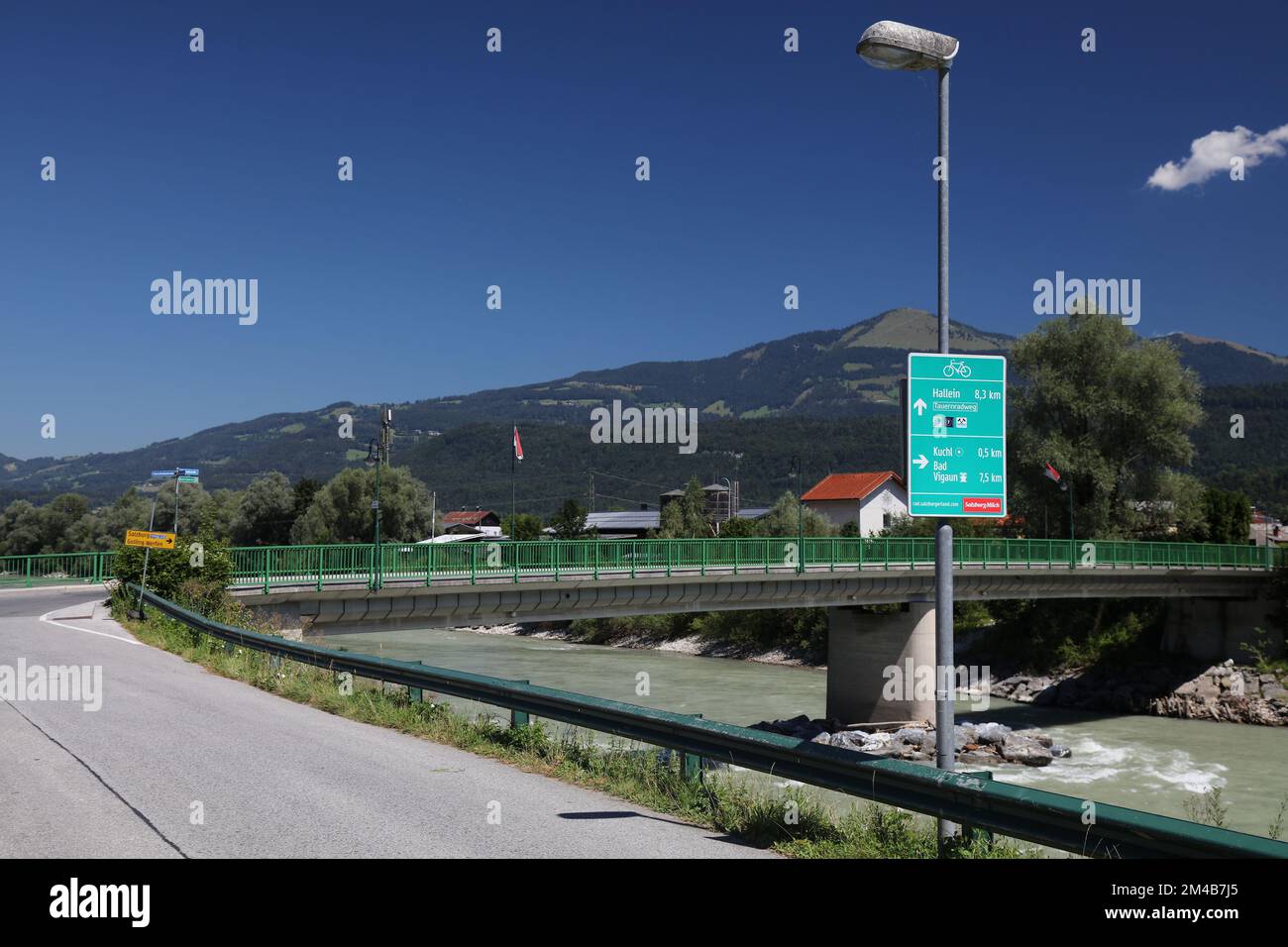 HALLEIN, AUSTRIA - AUGUST 4, 2022: Bicycle route direction signs in Hallein, including major long distance cycling route Tauernradweg in Austria. Stock Photo